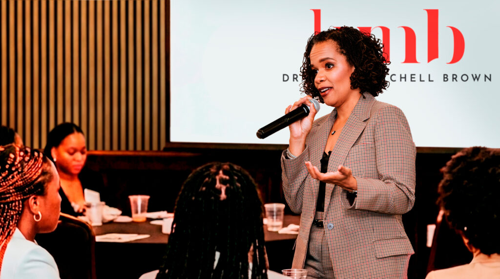 Dr. Kerry Mitchell Brown speaking to young black women